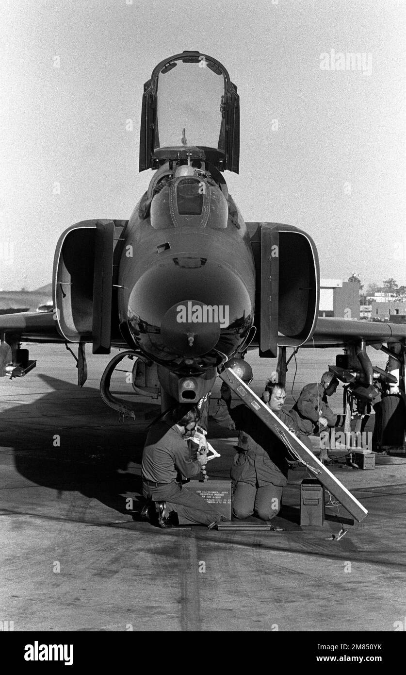 Airmen from the 69th Aircraft Maintenance Unit prepare to load the M-61A1 Vulcan 20mm multibarrel gun on a 347th Tactical Fighter Wing F-4E Phantom II aircraft. Base: Moody Air Force Base State: Georgia (GA) Country: United States Of America (USA) Stock Photo