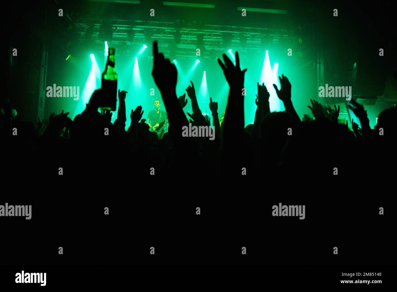 This concert is next level. A crowd of people cheering the band on st. Stock Photo