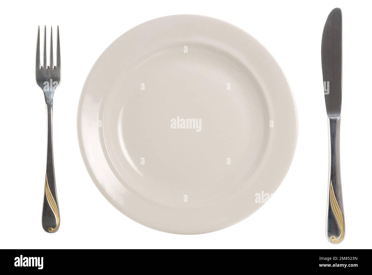 A plate with fork and knife on white Stock Photo - Alamy