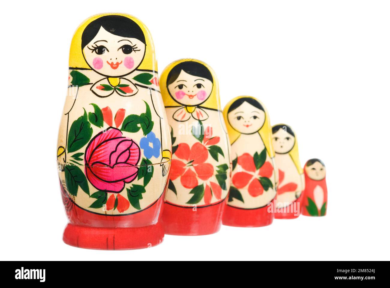 Russian traditional set of nesting wooden dolls on white Stock Photo
