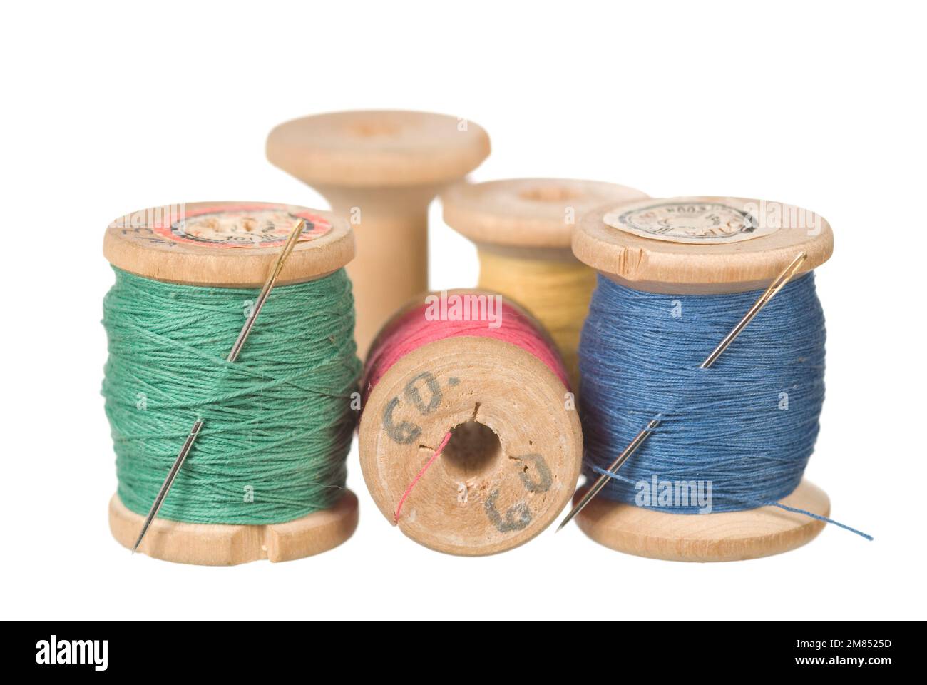 Vintage wooden reel of thread on white Stock Photo