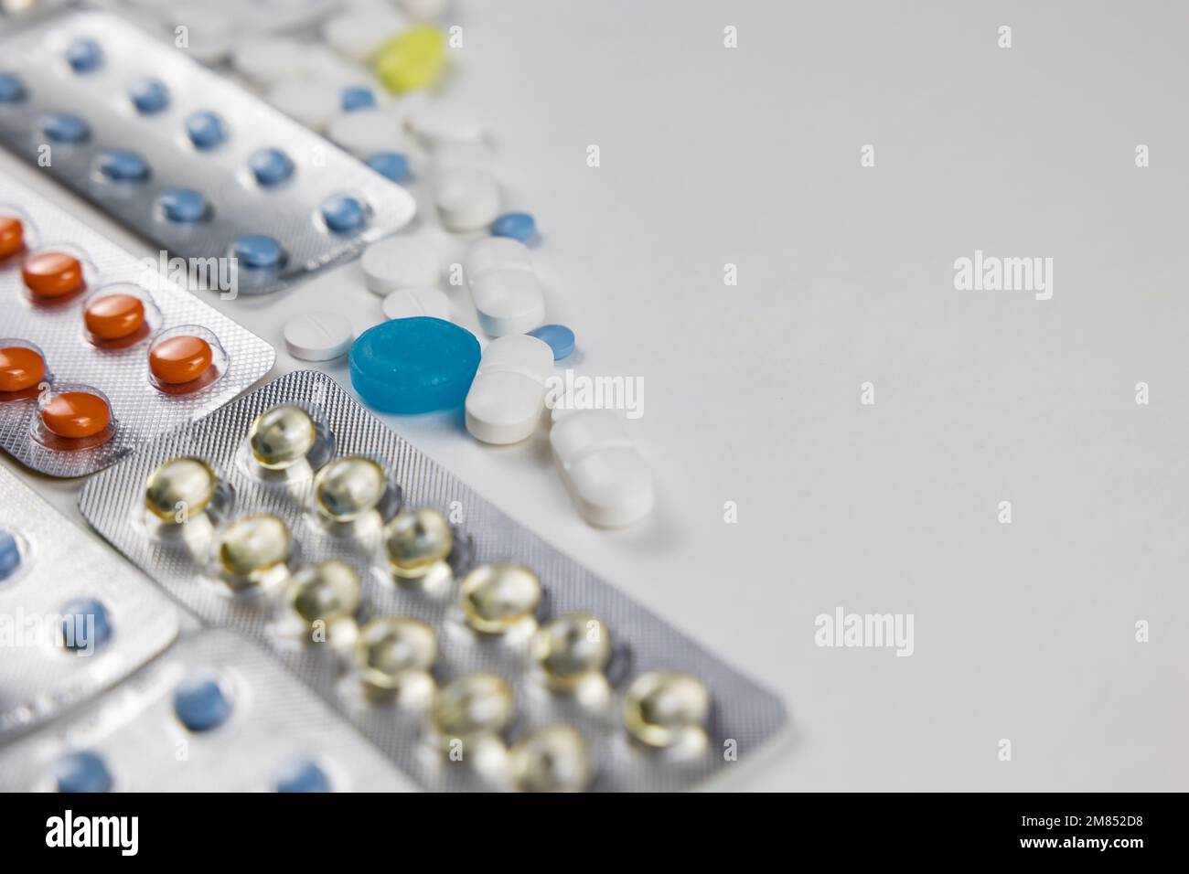 Pills or medicines background photo. Tablets and pills in the plastic blisters. Healthcare or medical concept photo with copy space. Stock Photo
