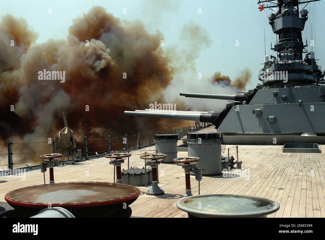 The three Mark 7 16inch/50caliber gun turrets of the battleship USS IOWA (BB61) are fired