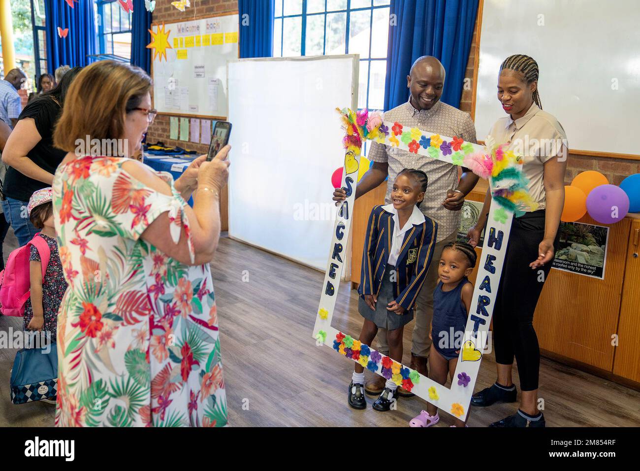 Johannesburg, South Africa. 11th Jan, 2023. Students and their parents pose for photos on the