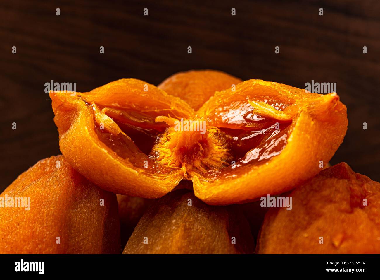 Half-dried persimmon made by drying persimmons Stock Photo