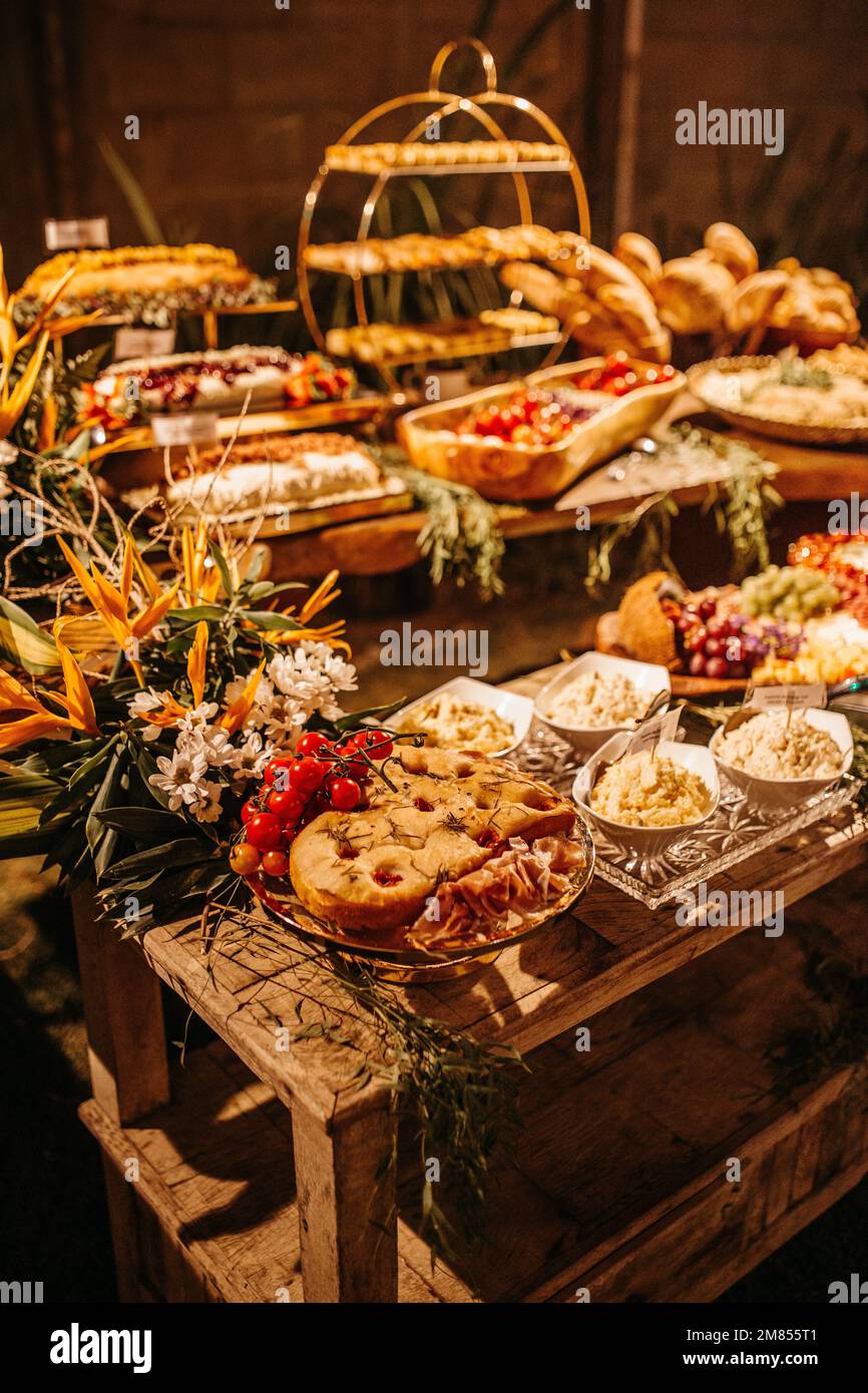 A wooden table with a variety of sweets and dishes Stock Photo - Alamy