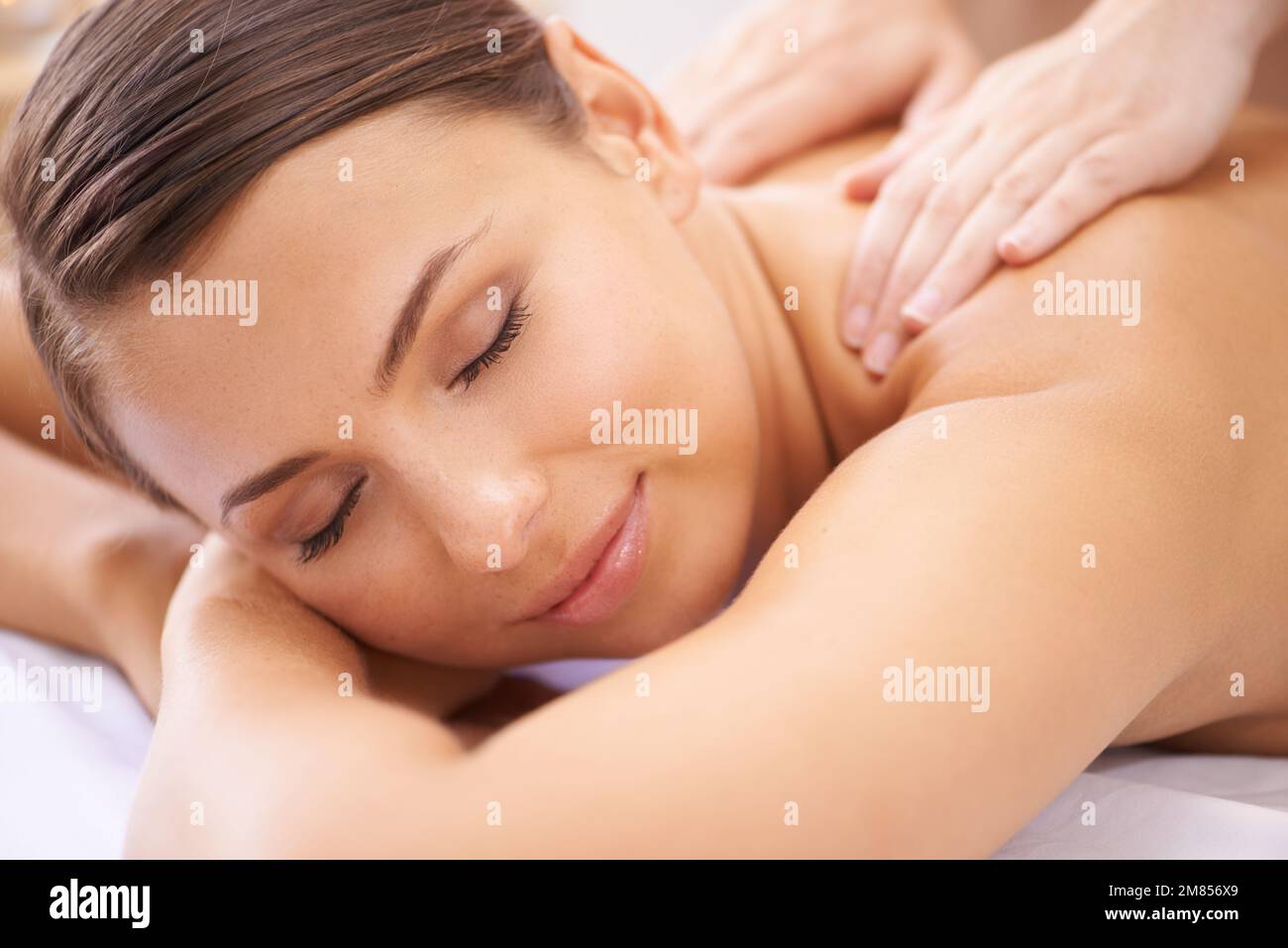 Shes in her own perfect world. A blissful young woman receiving Stock ...