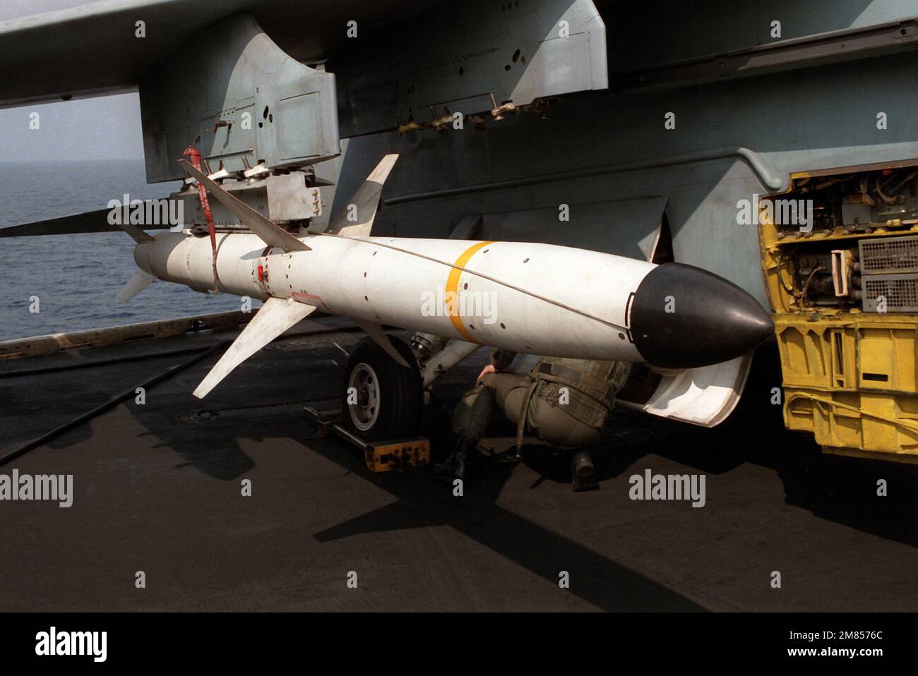 An AGM-88A High-speed Anti-Radiation Missile (HARM) mounted on the wing pylon of an A-7E Corsair II aircraft aboard the aircraft carrier USS SARATOGA (CV-60). Country: Mediterranean Sea (MED) Stock Photo