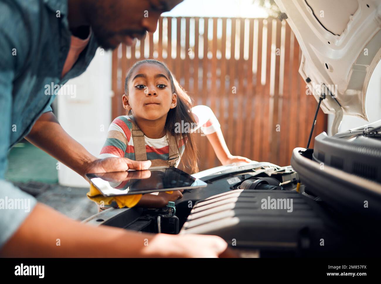 Car problem, tablet and diagnostic software with man and child learning