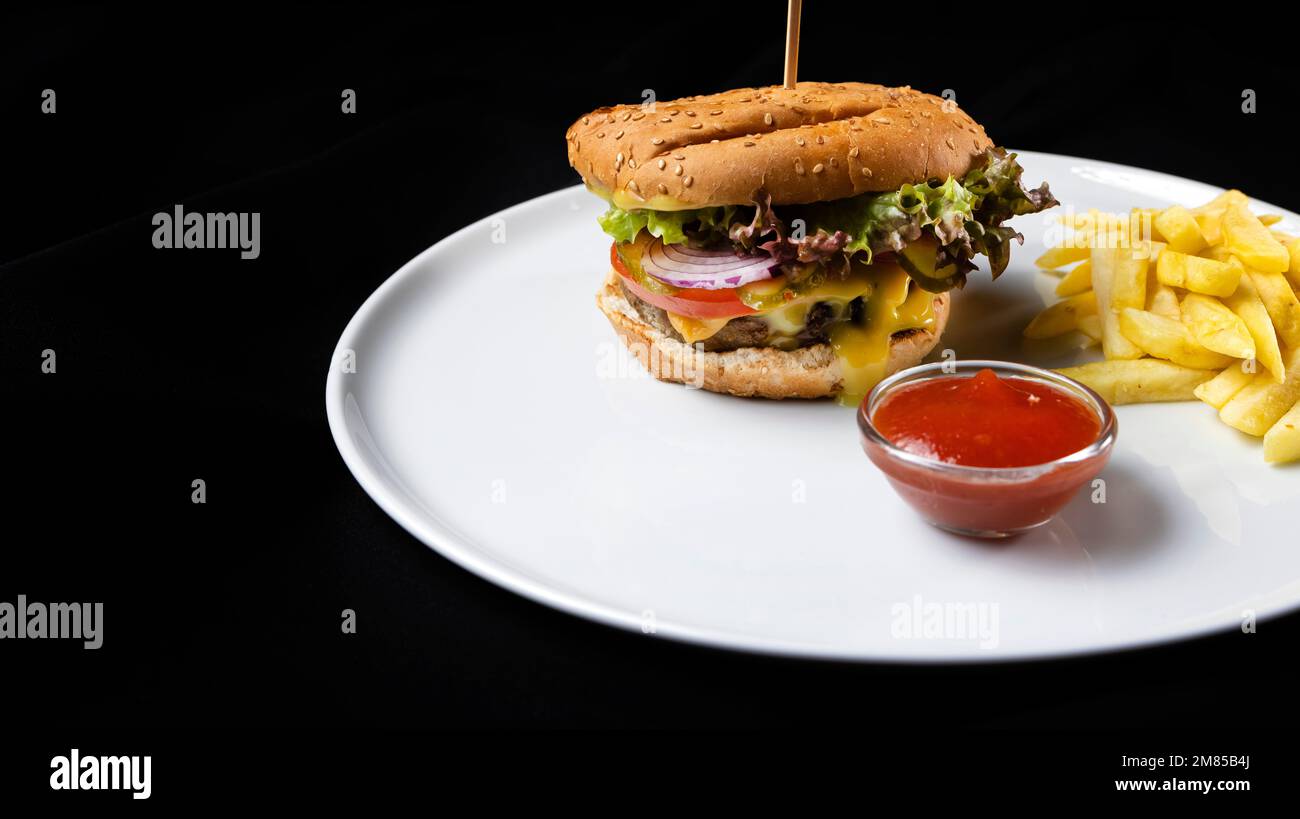 Burger and fries potato Stock Photo - Alamy
