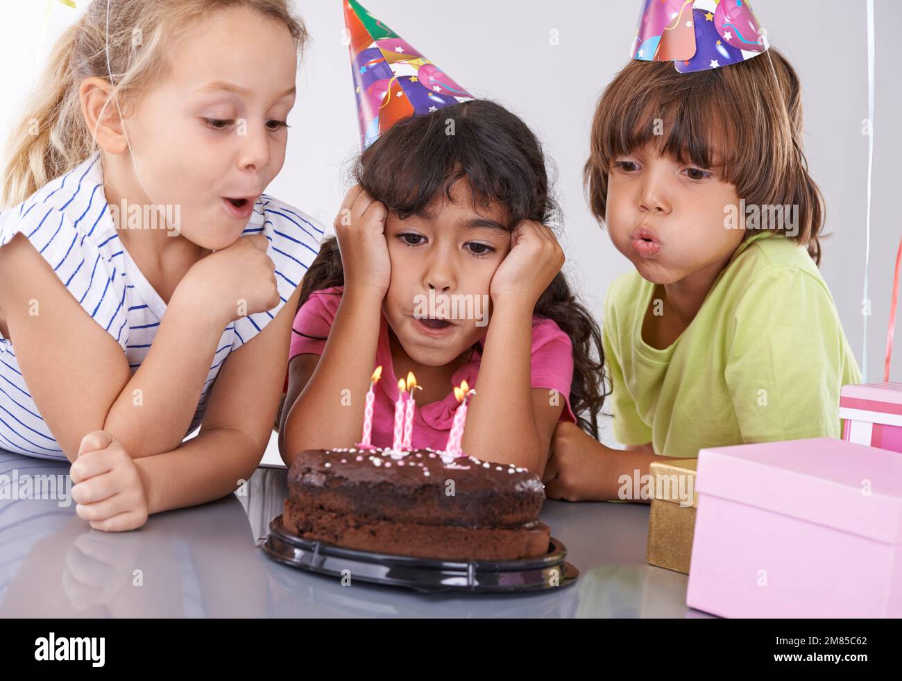 Shes going to remember this birthday. A young girl blowing out her