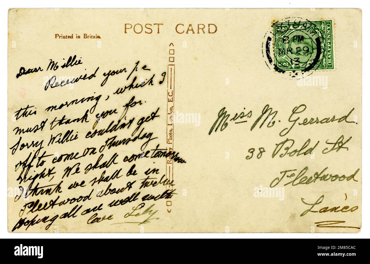 Reverse of original handwritten Titanic era postcard, franked and with King George V half penny postage stamp. Postmarked / dated  March 1913. Stock Photo