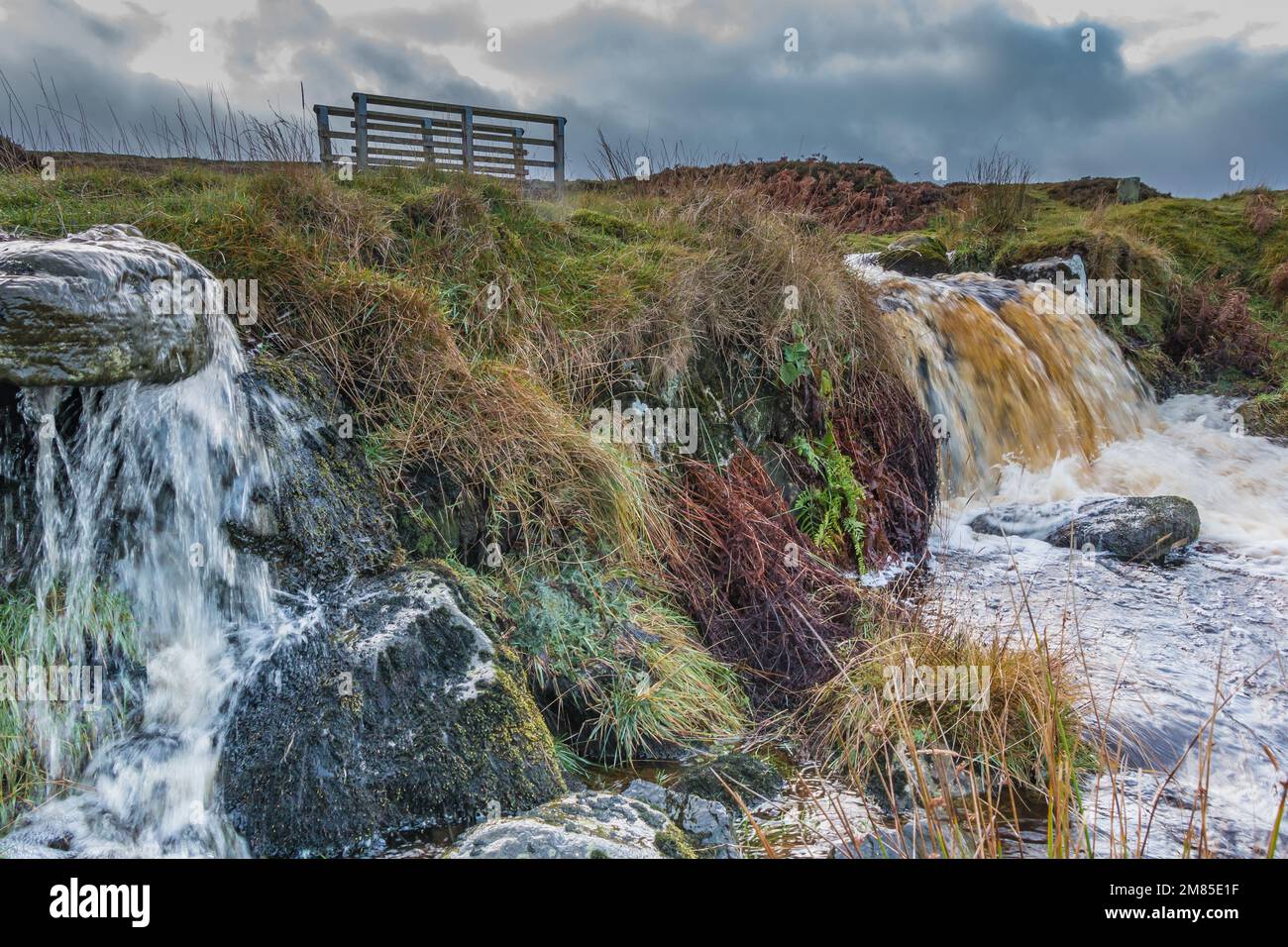 An attractive small waterfall and cascade on a beck flowing off Barningham Moor. Stock Photo