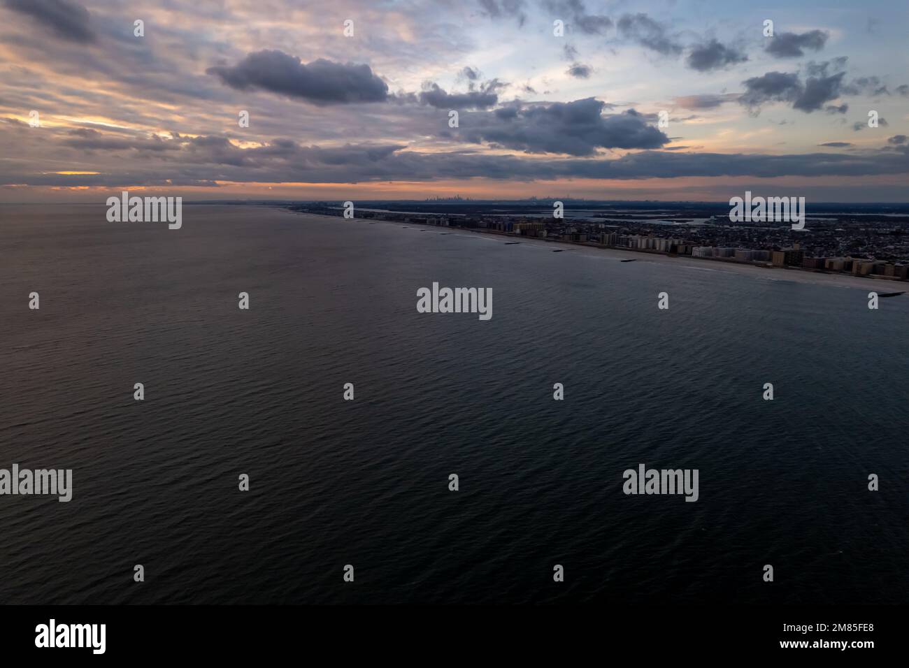 An aerial view of the seascape and the Long Beach under cloudy dusk sky in New York, United