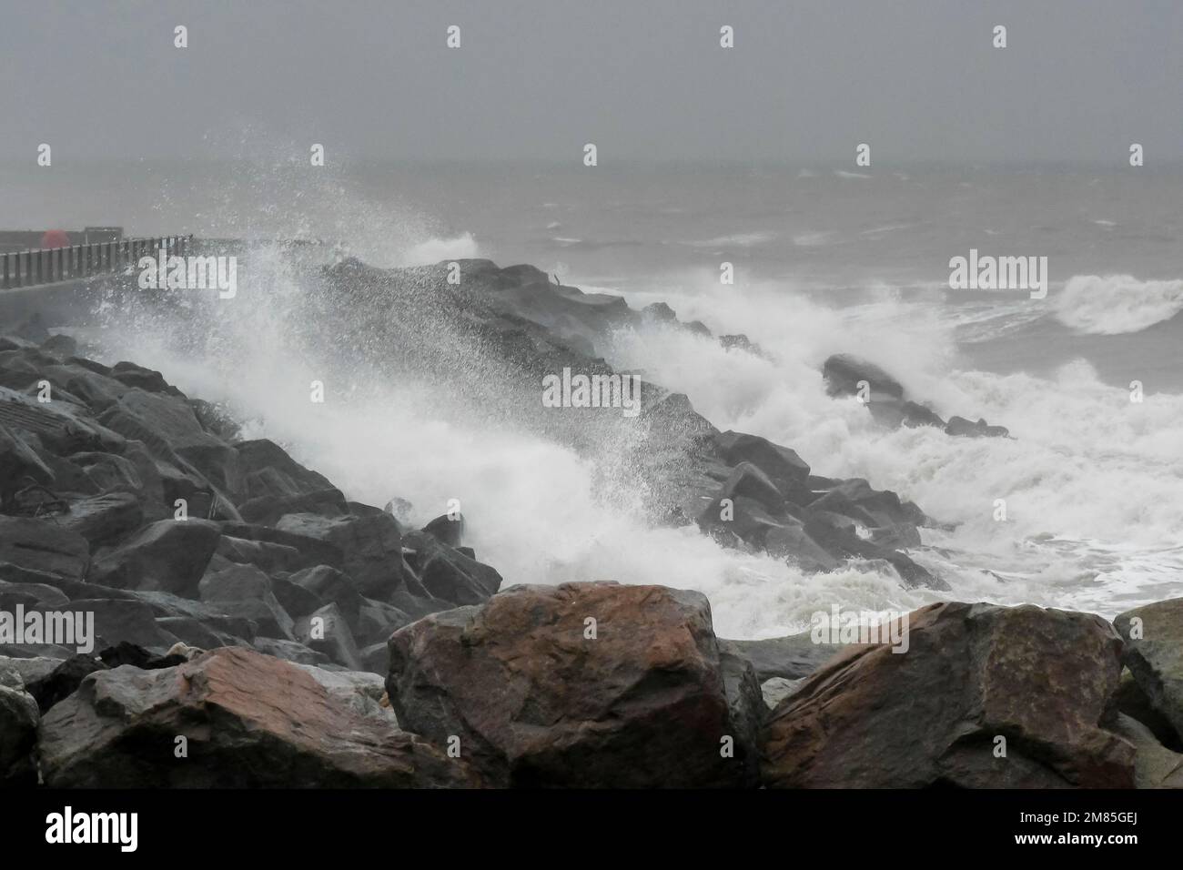 West Bay, Dorset, UK.  12th January 2023.  UK Weather.  Rough seas crash against the sea defences at West Bay in Dorset on a wet and windy day.  Picture Credit: Graham Hunt/Alamy Live News Stock Photo