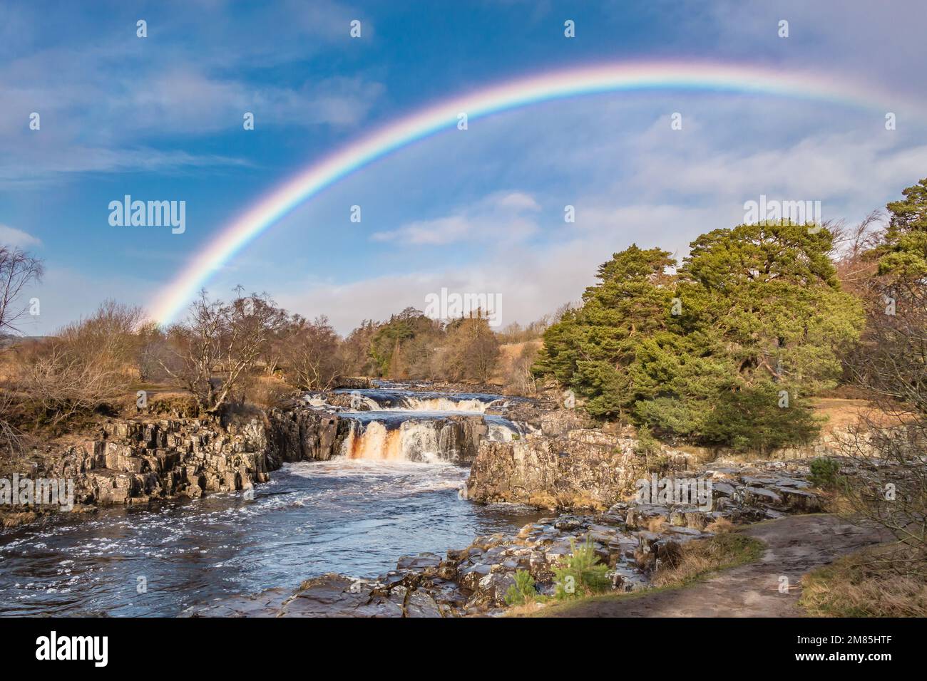 A vivid rainbow over Low Force Waterfall, Teesdale Stock Photo
