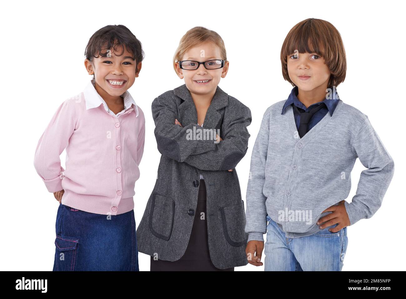 Confident kids. Three young children pretending to be grown-ups. Stock Photo