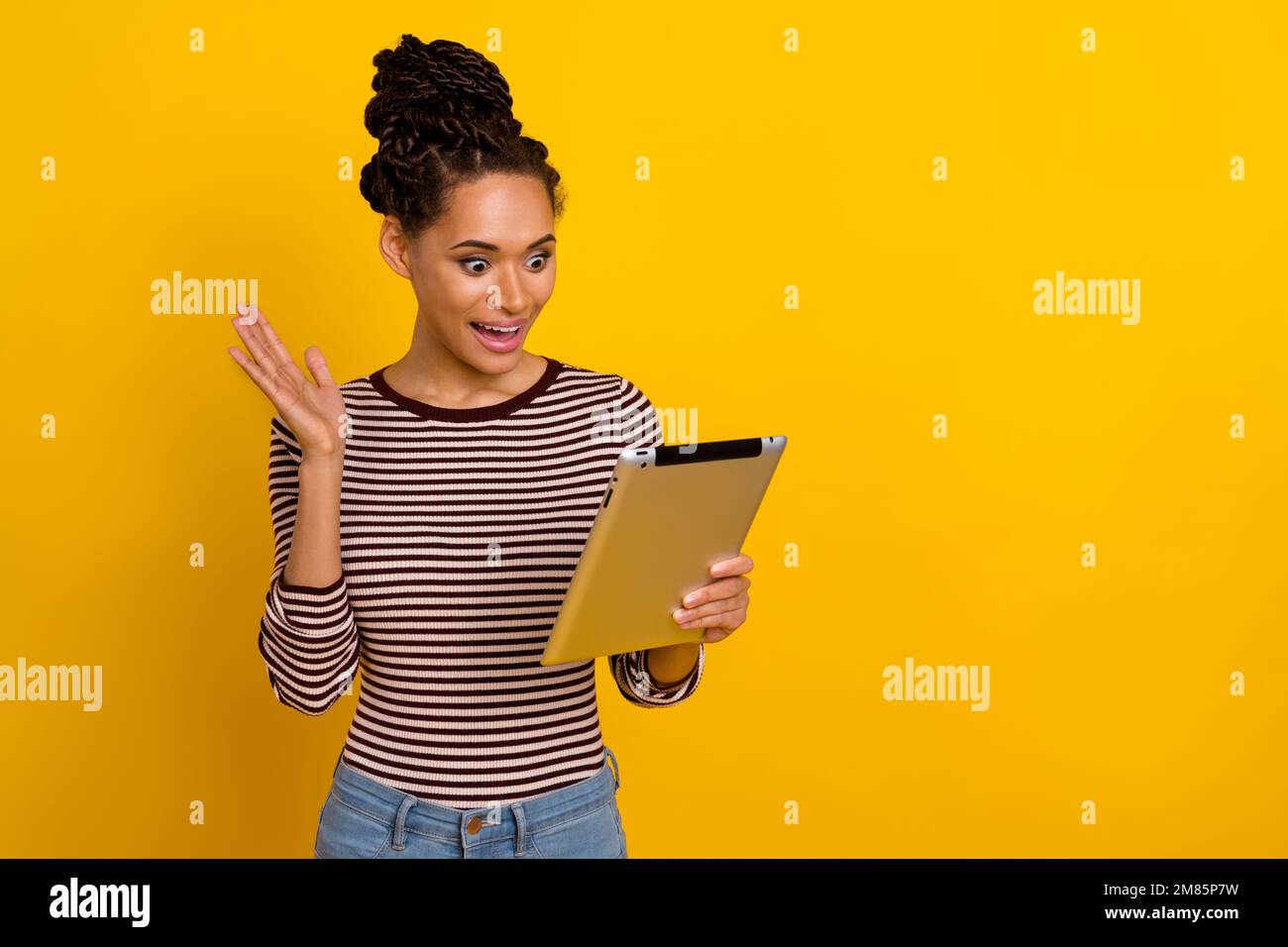 Portrait of pretty positive person hold tablet arm palm waving hi ...