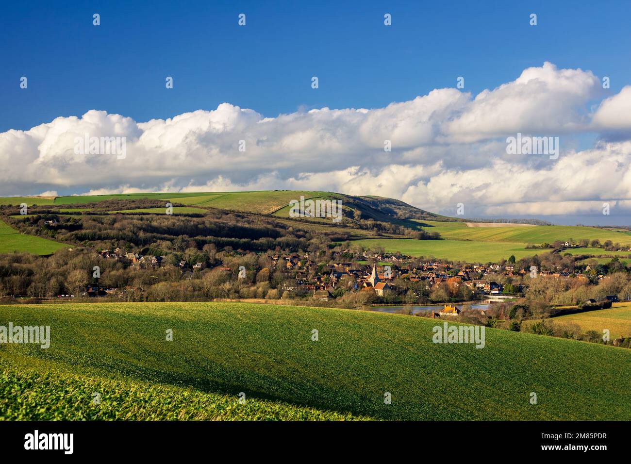 Alfriston village and church nestled in the south downs hills and countryside east Sussex south east England Stock Photo