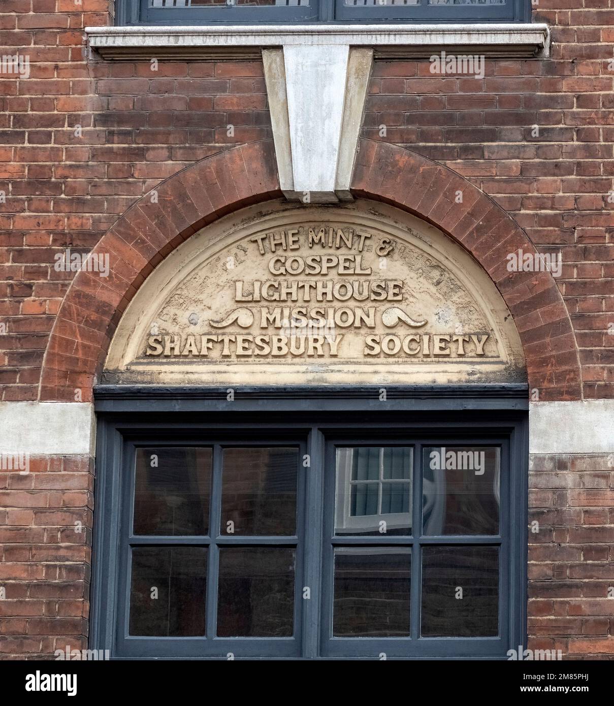 LONDON, UK - MARCH 13, 2019:  Sign above entrance to Mint and Gospel Lighthouse Mission on Union Street.  Originally known as Ragged School Stock Photo