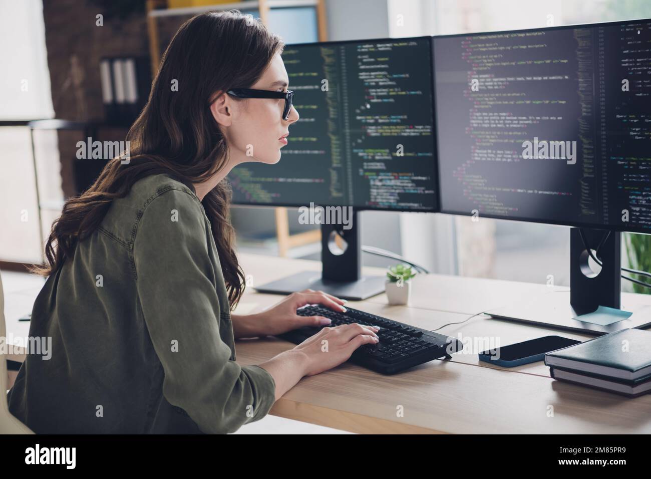 Photo of clever busy lady cyber safety expert wear glasses coding modern device indoors workstation workshop Stock Photo