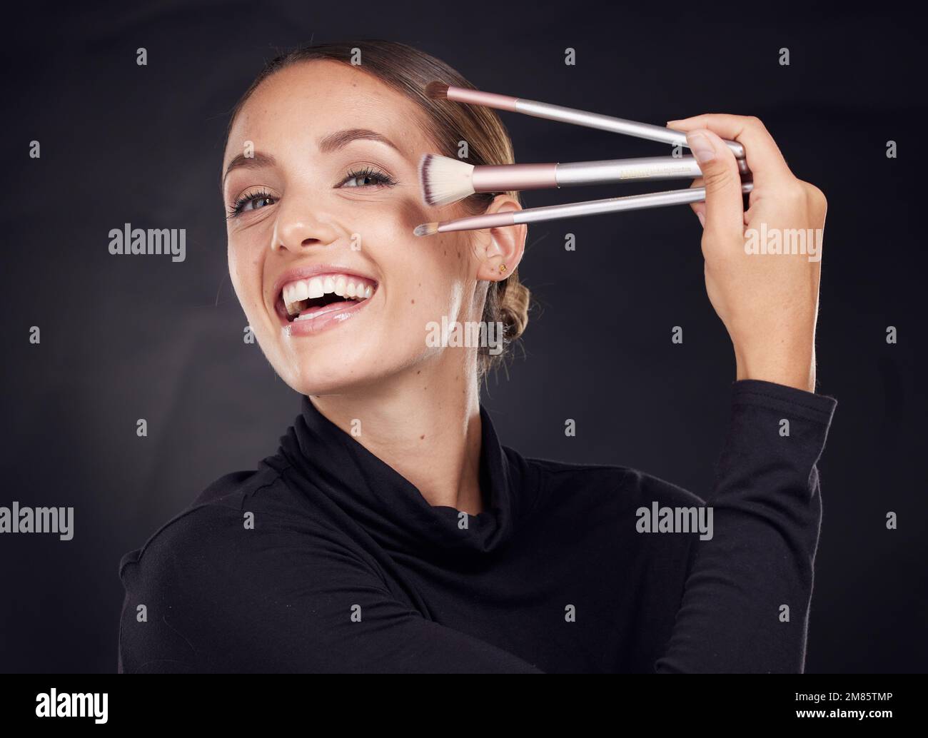 Beautiful teen girl holding makeup brushes Stock Photo by ©stockyimages  27657527