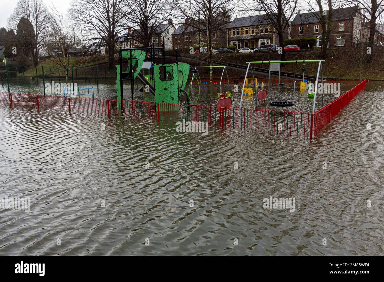 Playground equipment underwater at the play park in Taffs Well, Wales. Picture date: Thursday January 12, 2023. Stock Photo