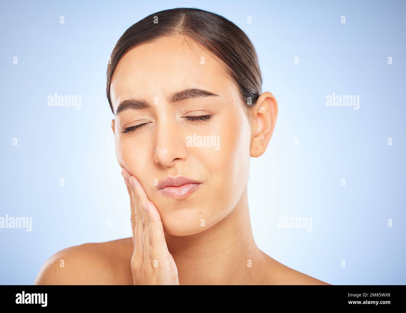 Toothache, pain and cavity with a model woman holding her mouth in