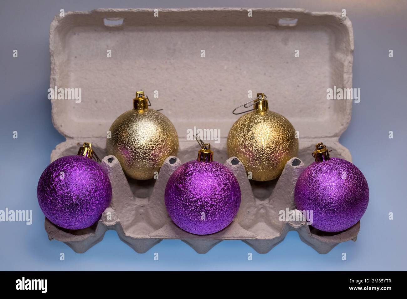 Christmas tree glitter balls in egg carton box. Easter and New Year concept Stock Photo