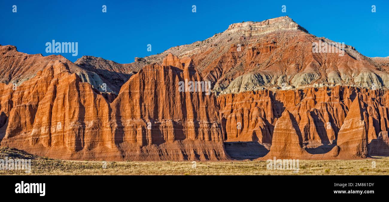 Entrada Sandstone fluted walls and spires near Temple of the Moon, Lower Cathedral Valley, Capitol Reef National Park, Utah, USA Stock Photo