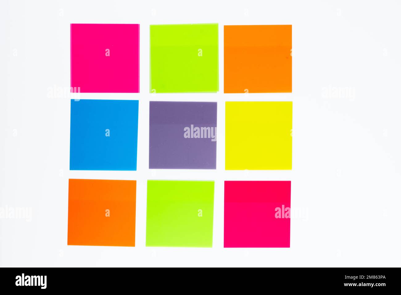 template  concept idea a grid of colored post it sticky notes laid out in a square for a mock up for different use ideas isolated on a white backgroun Stock Photo