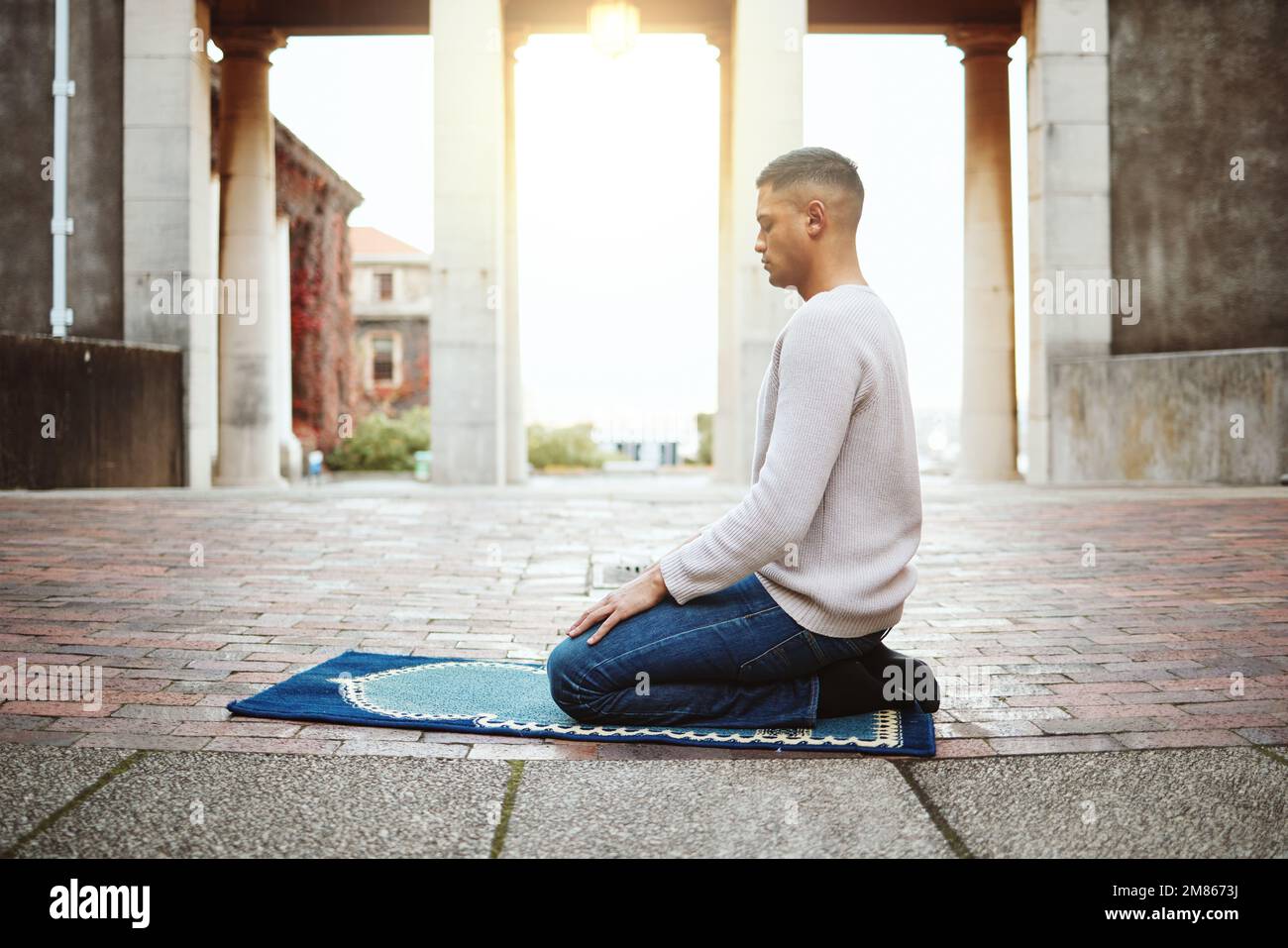 Muslim, faith and praying with an islamic man prayer to god on a carpet ...