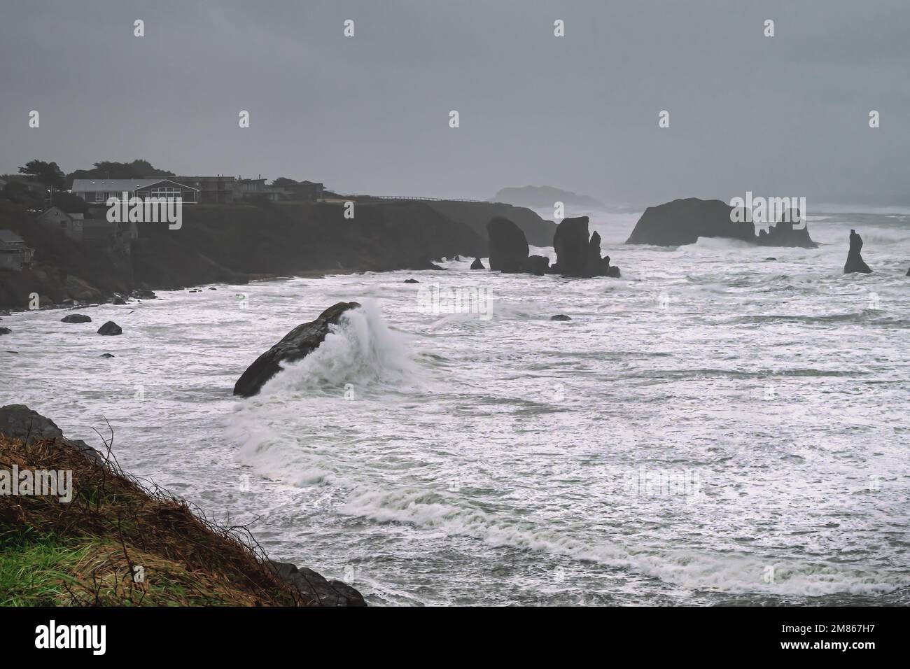 Extreme high tide covers all of the beach in Bandon, Oregon during strong bomb cyclone storm Stock Photo