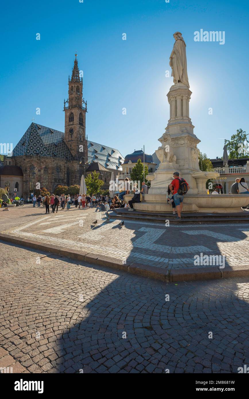 Piazza Walther Bolzano, view in summer of the Piazza Walther in the centre of Bolzano with the medieval Cathedral (Dom) and tower visible beyond,Italy Stock Photo