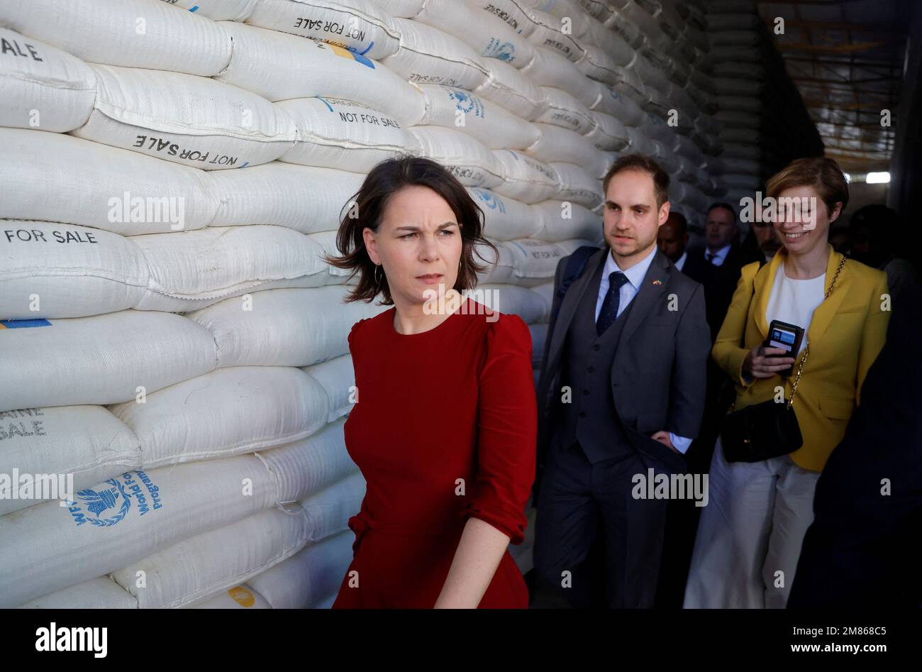 Germany Foreign Minister Annalena Baerbock inspects bags of wheat which were donated during her visit to the World Food Programme (WFP) warehouse in Adama, Ethiopia January 12, 2023. REUTERS/Tiksa Negeri Stock Photo