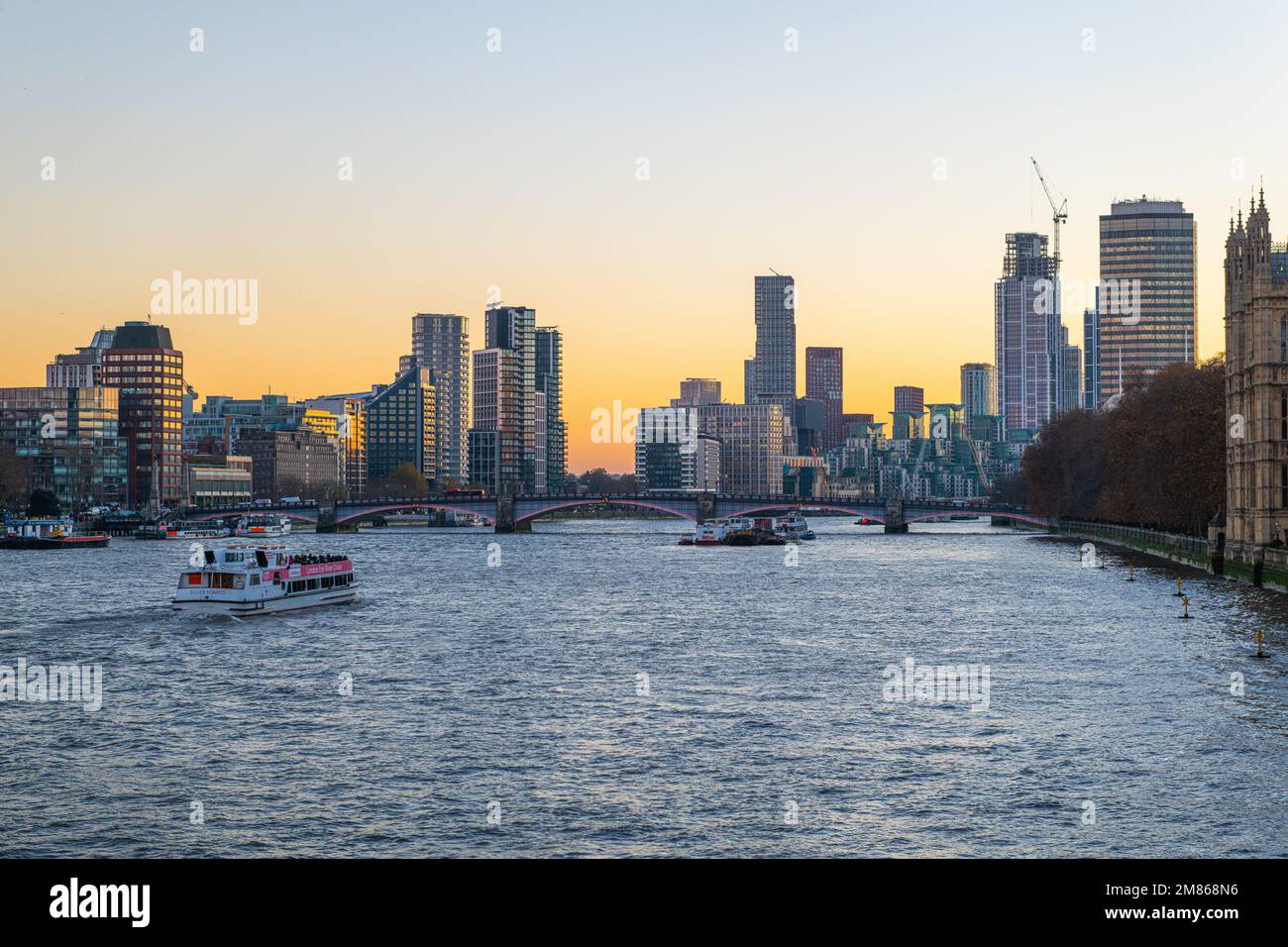 A beautiful view of the Tower Bridge over the Thames river at sunset in London, United Kingdom. Stock Photo