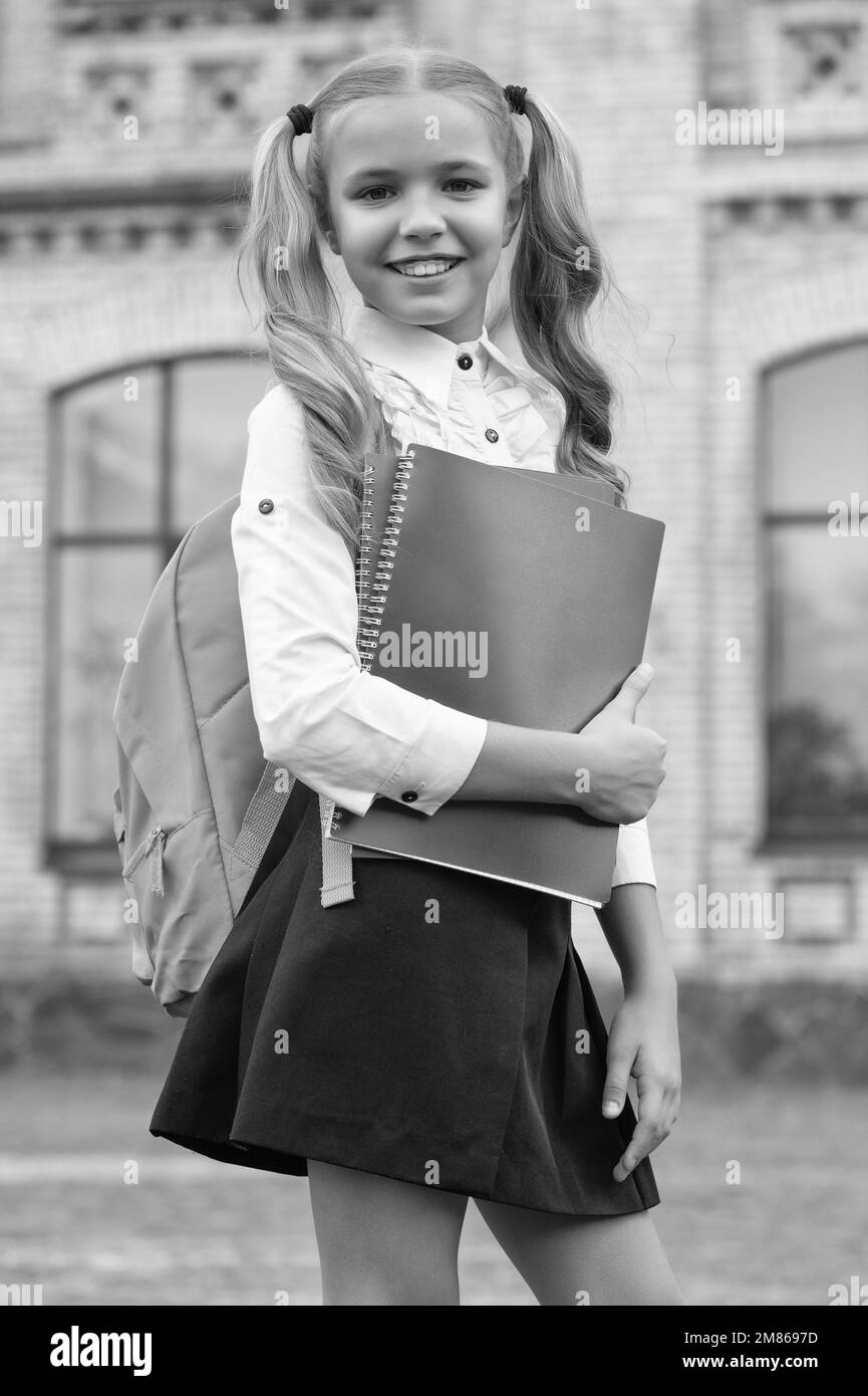 Child carrying books Black and White Stock Photos & Images - Alamy