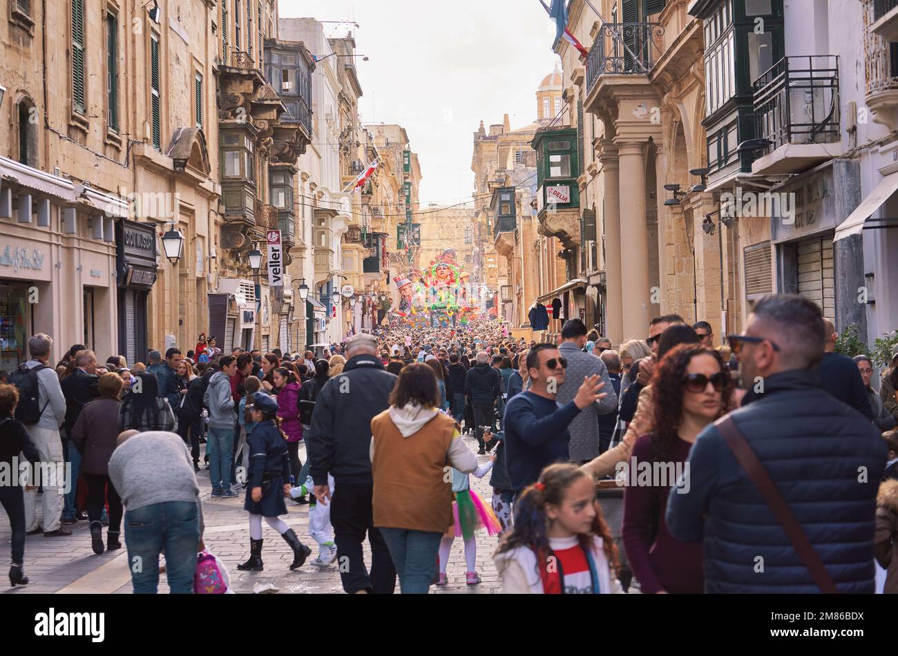 Grand Parade of colorful carnival-floats during Mardi Gras in Valletta street in Malta. Annual Fat Tuesday Maltese street parade allegorical floats Stock Photo