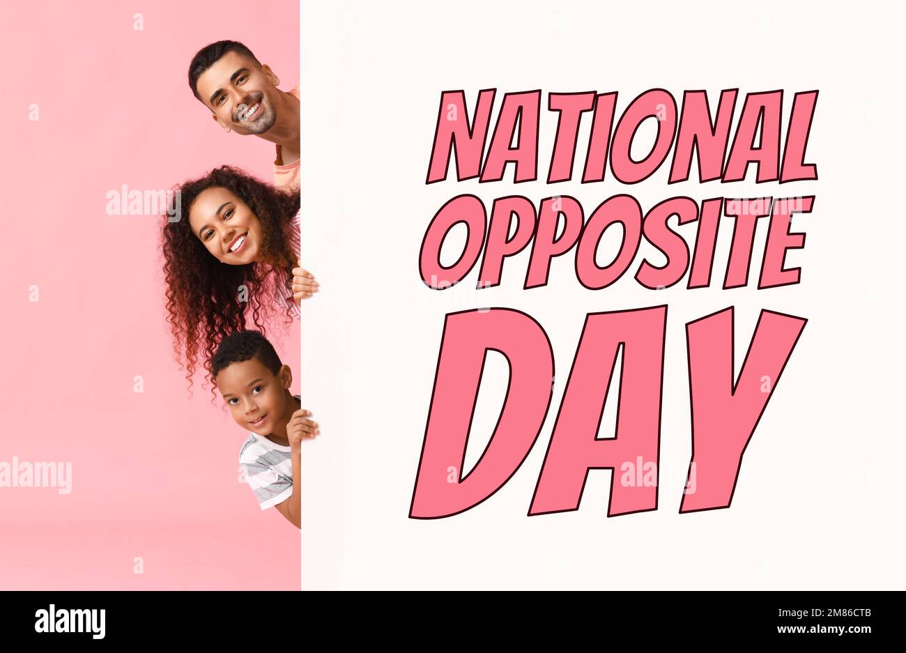 Happy interracial family and big poster with text NATIONAL OPPOSITE DAY