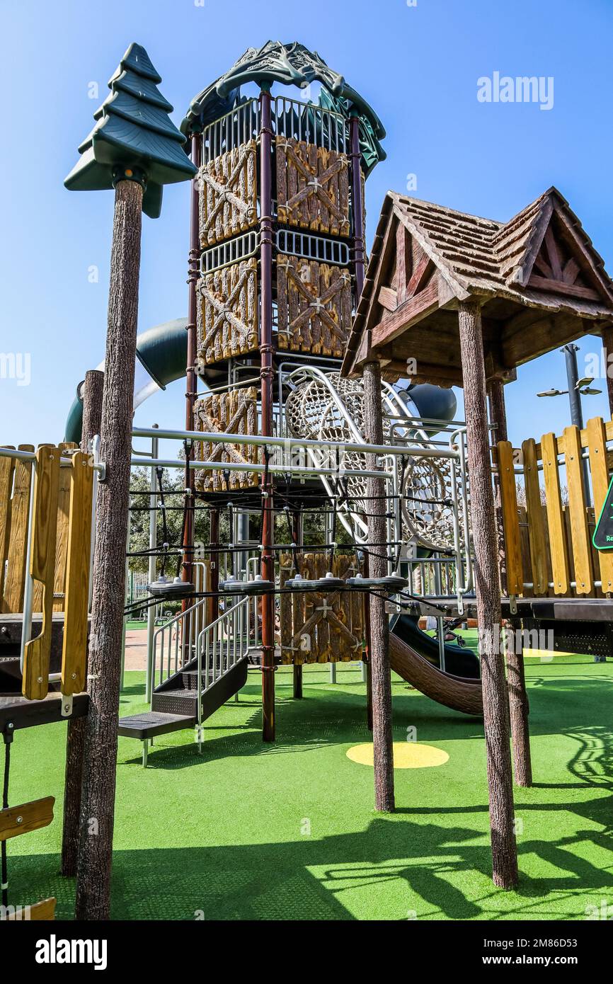 View of children's complex with bridge on playground Stock Photo - Alamy
