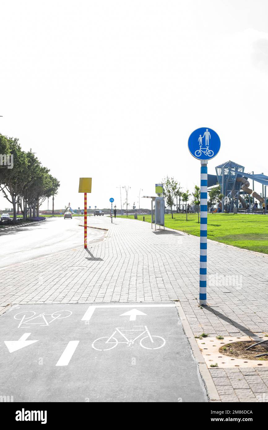 View of road with bicycle signs and pavement Stock Photo - Alamy