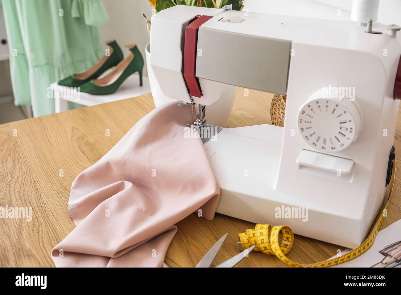 Tailor couturier measuring cloth. Closeup of sewer woman hands