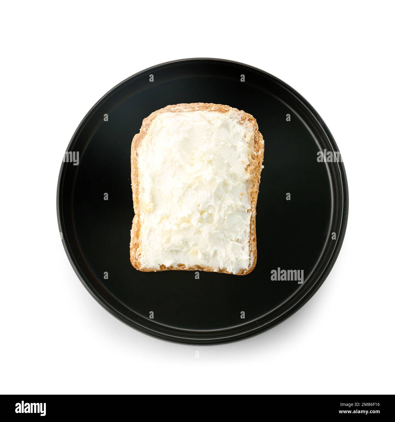 Plate of toast with cream cheese on white background Stock Photo - Alamy