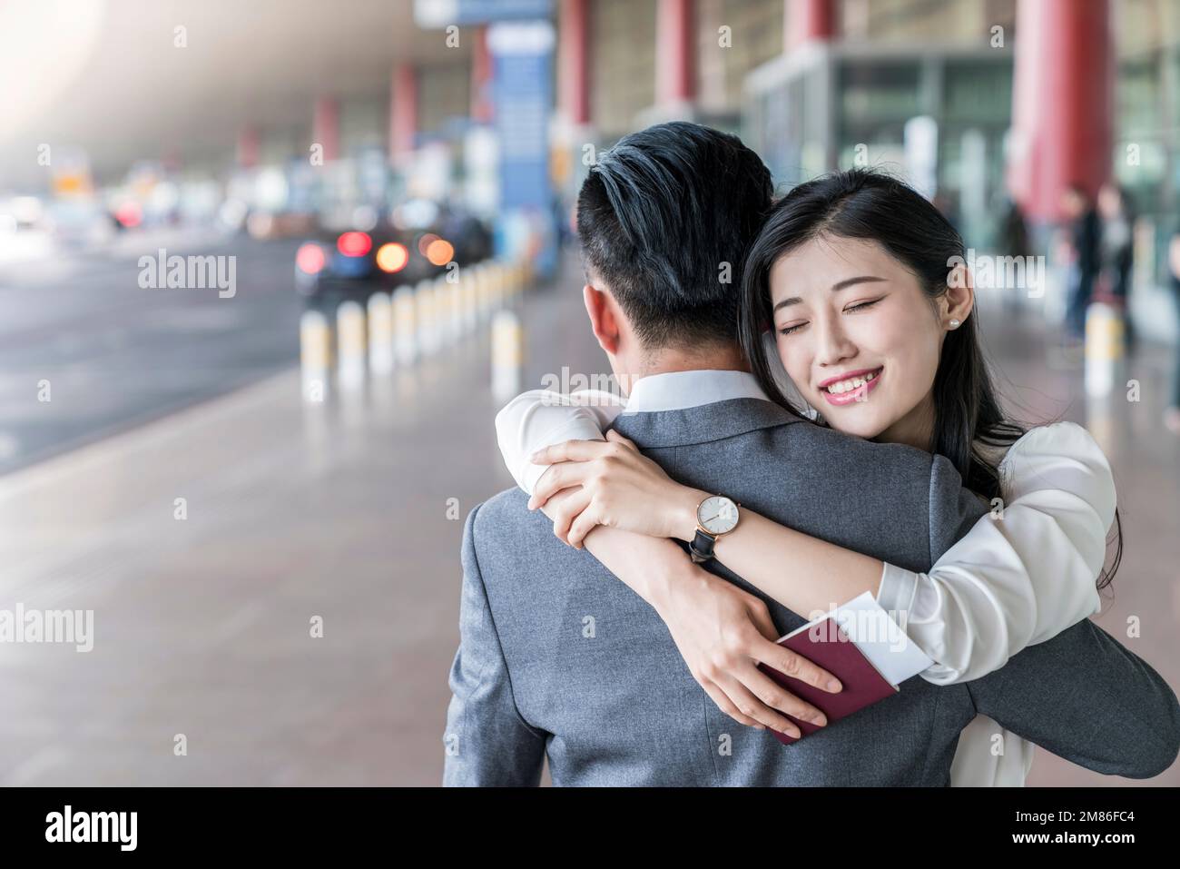Two friends hug airport hi-res stock photography and images - Alamy