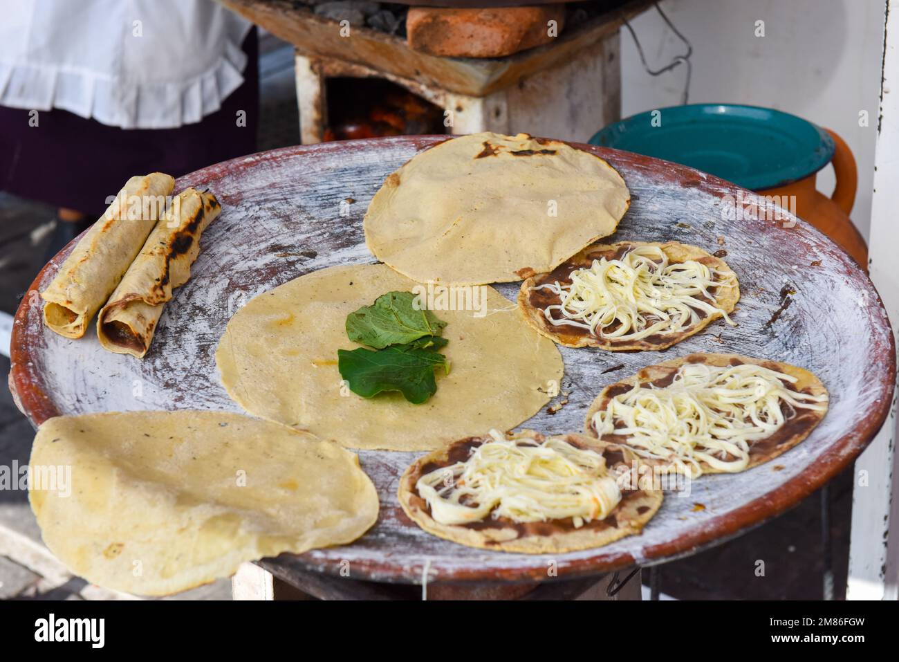 Tlayudas (big roasted tortillas) at a street food stall in Oaxaca city