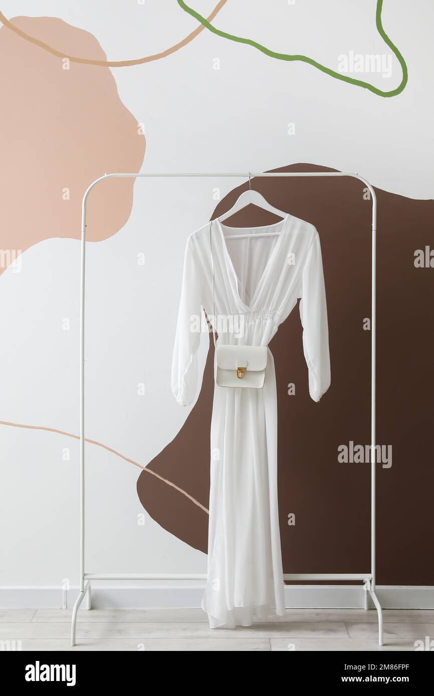 Dress bag hanging wall hi-res stock photography and images - Alamy