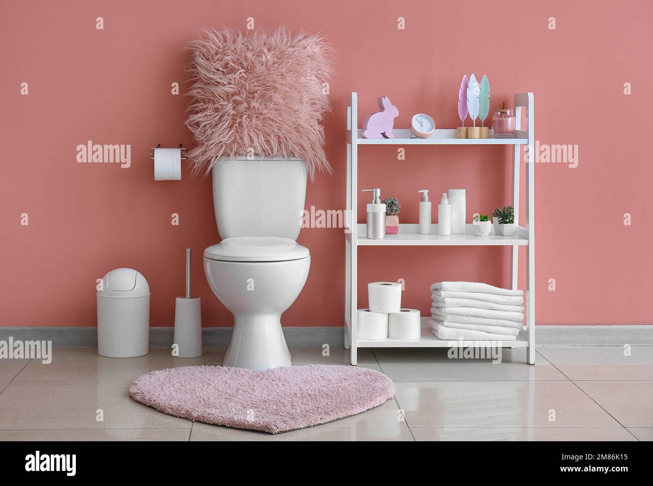 Toilet Bowl Rug Interior of restroom with ceramic toilet bowl, rug and shelving unit ...