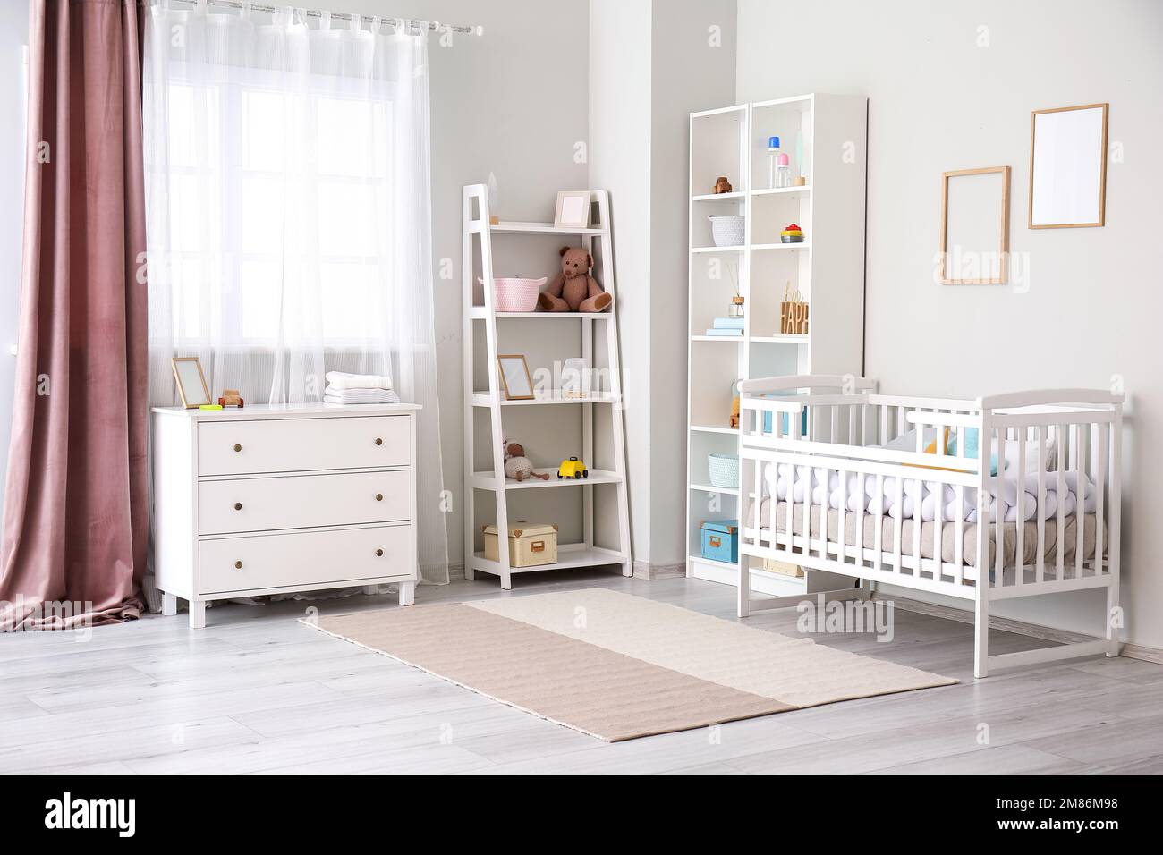 Stylish interior of children's room with baby bed Stock Photo Alamy
