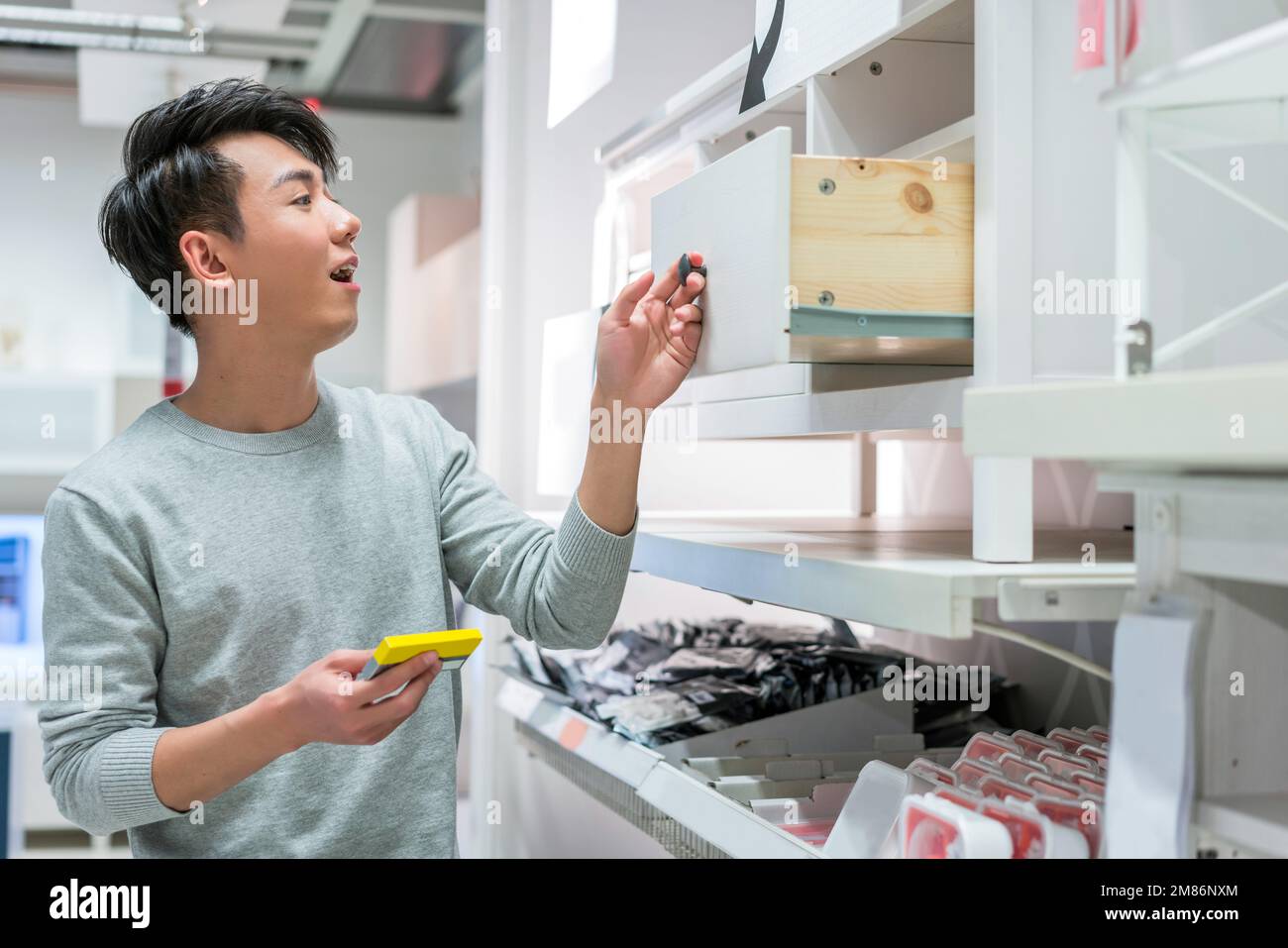 The young man selected articles for daily use Stock Photo Alamy