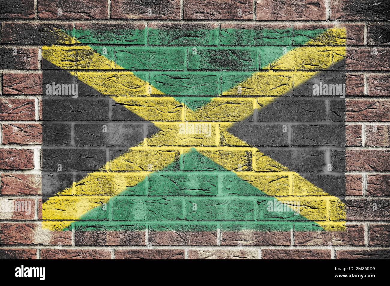 Jamaica flag painted on brick wall background Stock Photo